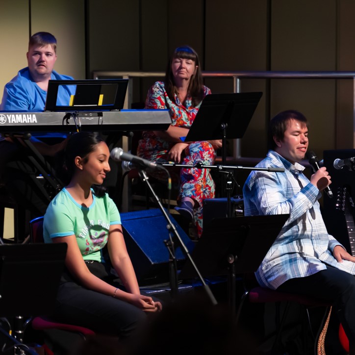 Ensemble performers pictured Johanna Jacob (Voice) Green top, Michael Brennan (guitar) in a blue and wuite checked shirt, Matthew Nealis (Keyboard)