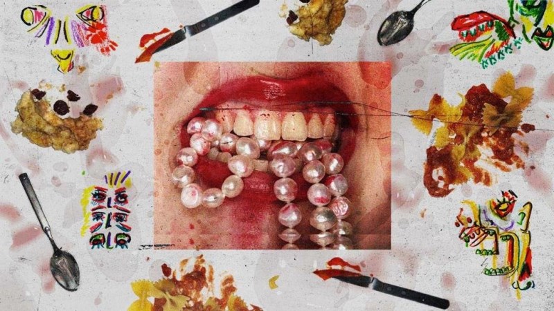 Image of a mouth biting a pearl necklace against a backdrop which resembles a dirty tablecloth